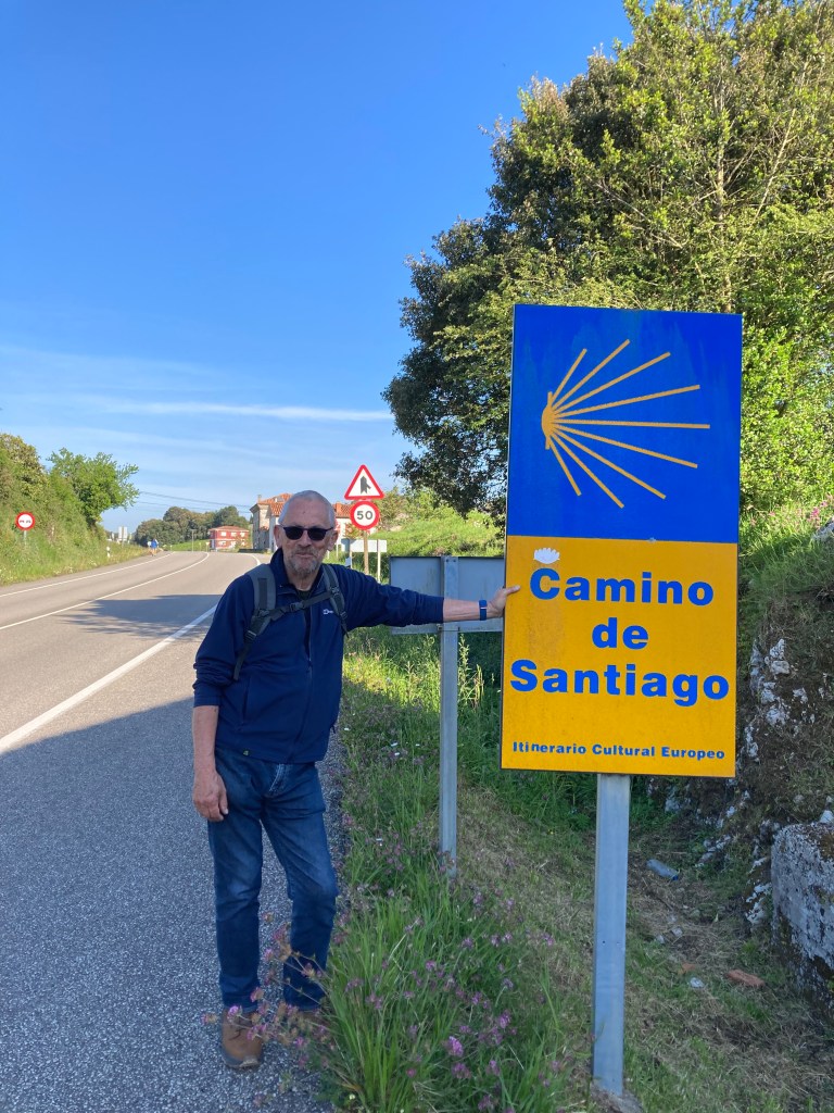 Julian by road sign for the Camino de Santiago.