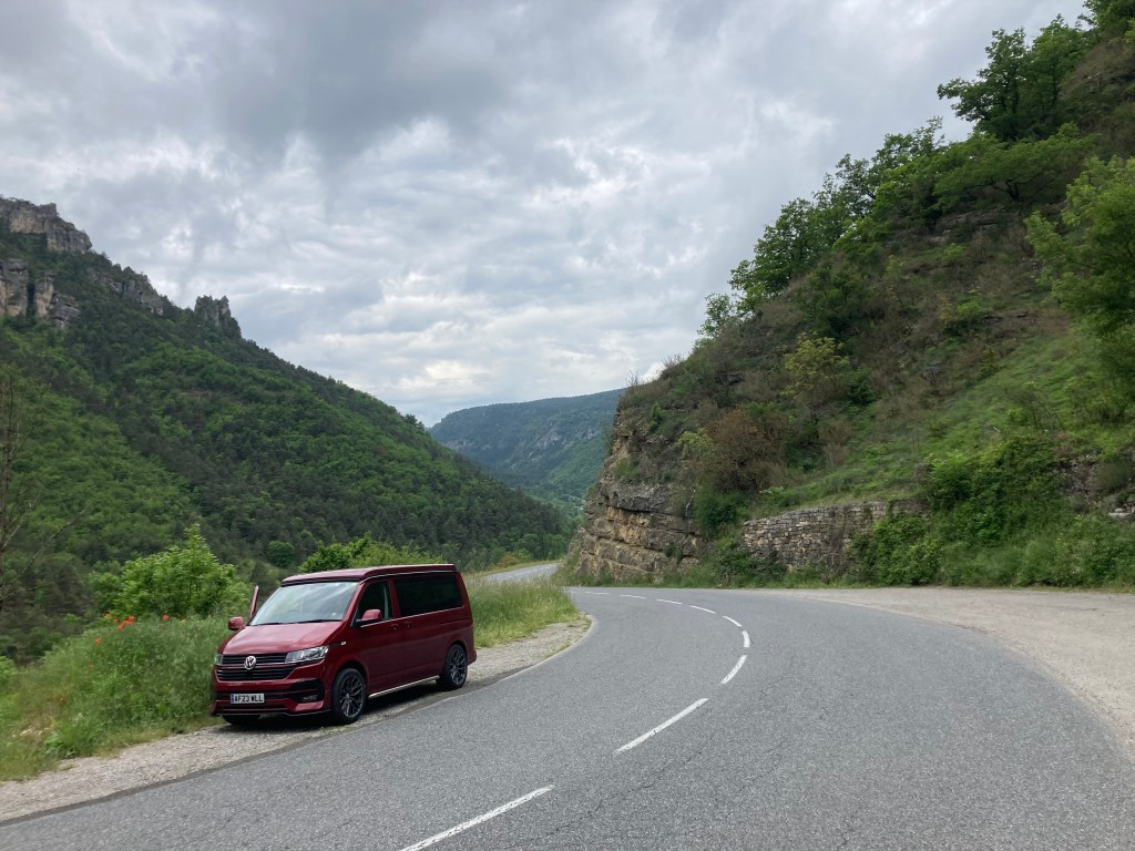 Red campervan in mountain scenery